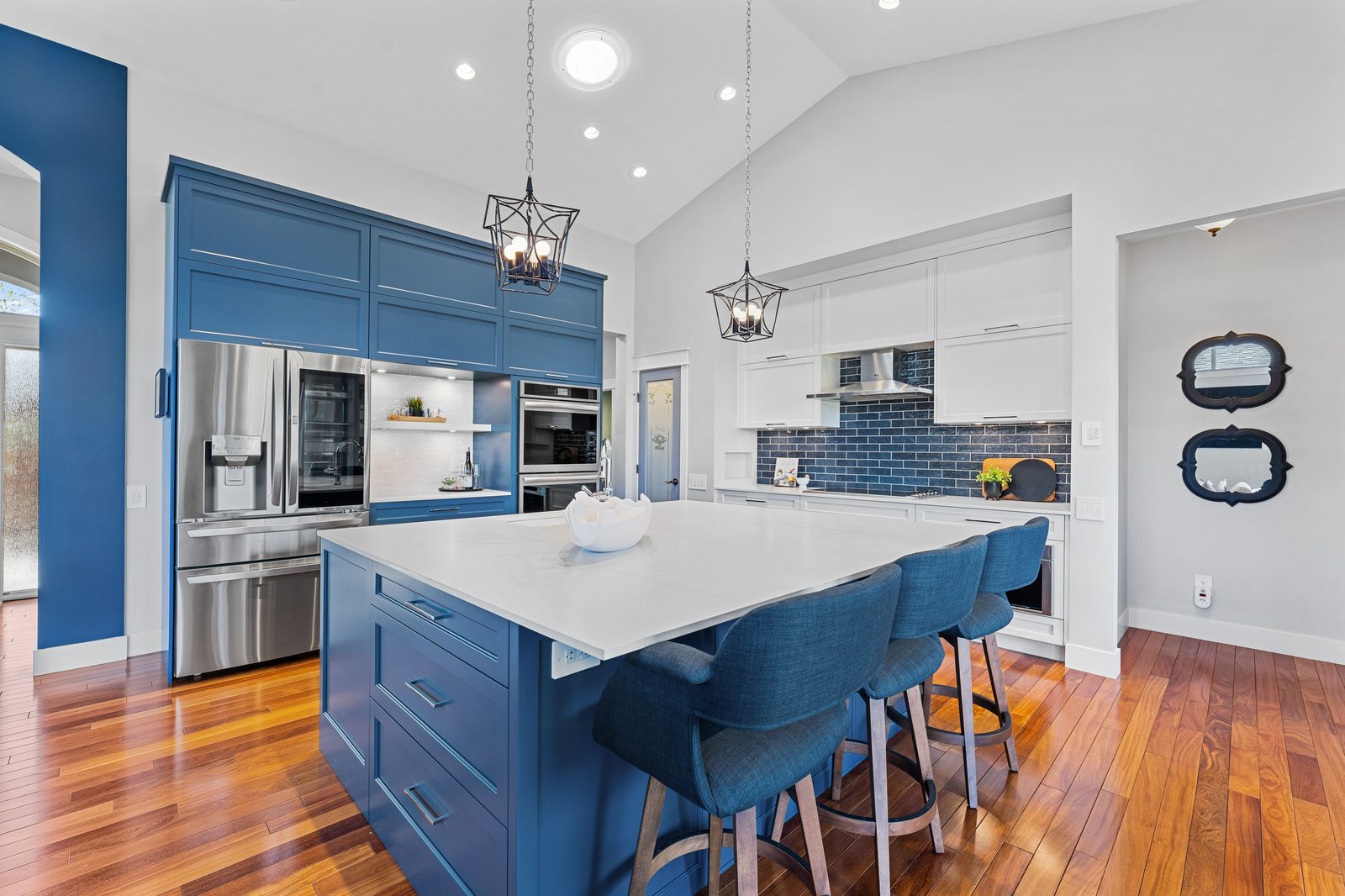 Blue millwork kitchen with stainless appliances