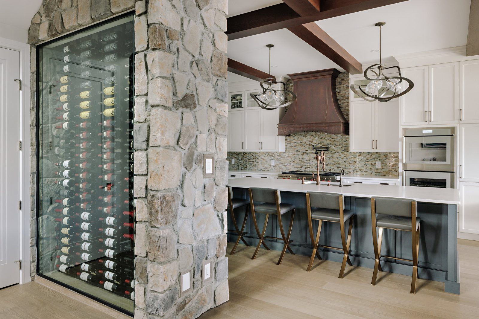 Stone wine cellar and kitchen millwork