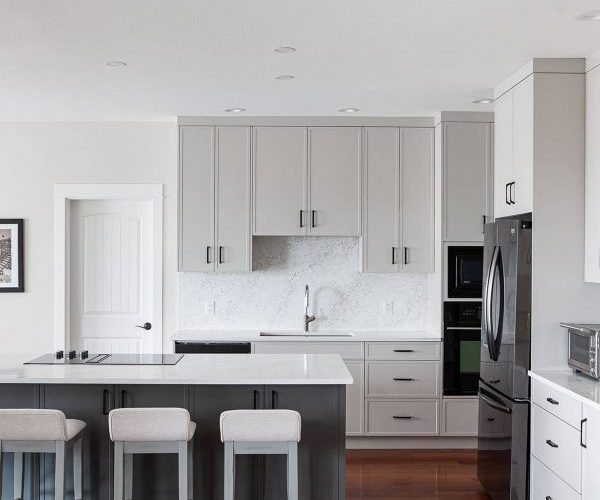Grey millwork kitchen with island seating