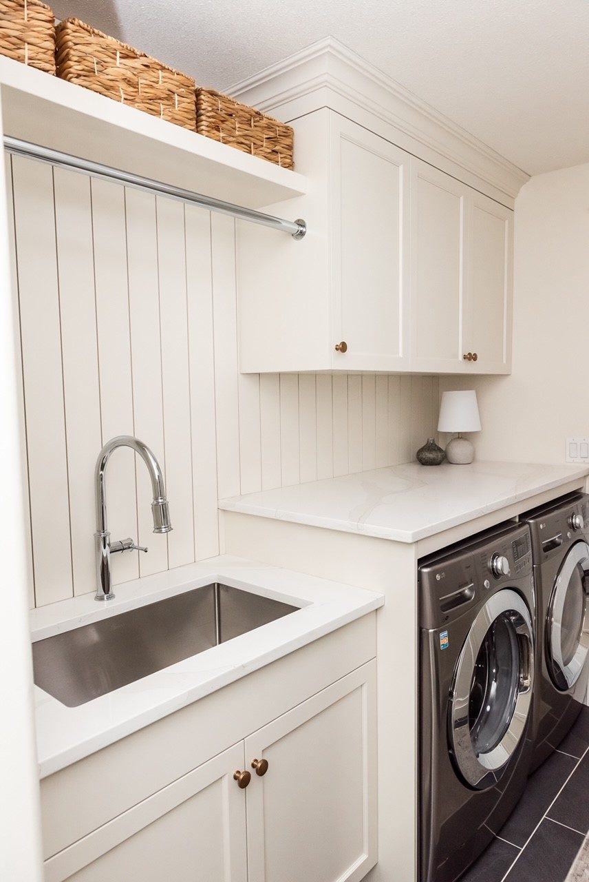 Laundry millwork with utility sink and hanging rail