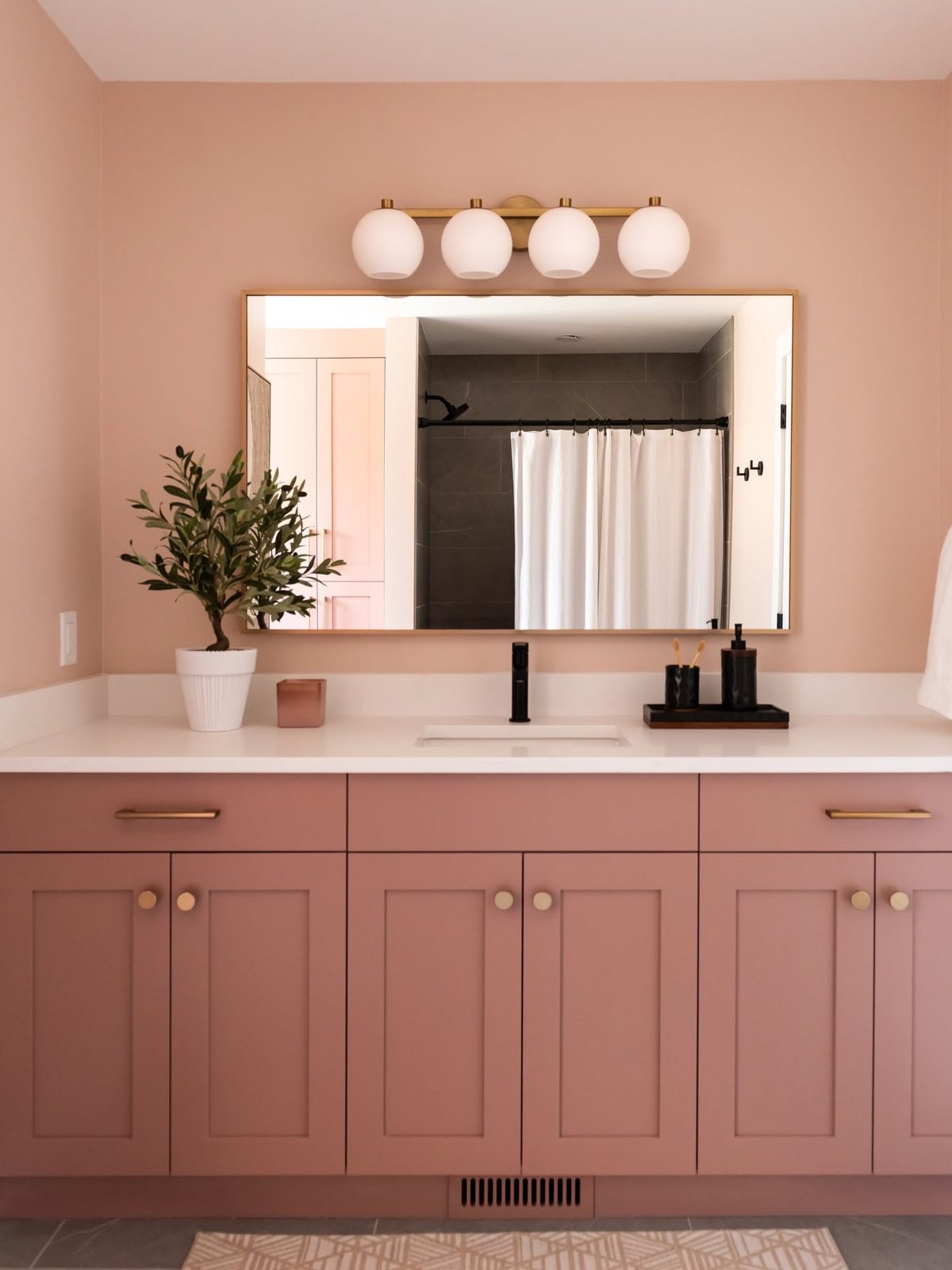 Custom pink bathroom vanity millwork