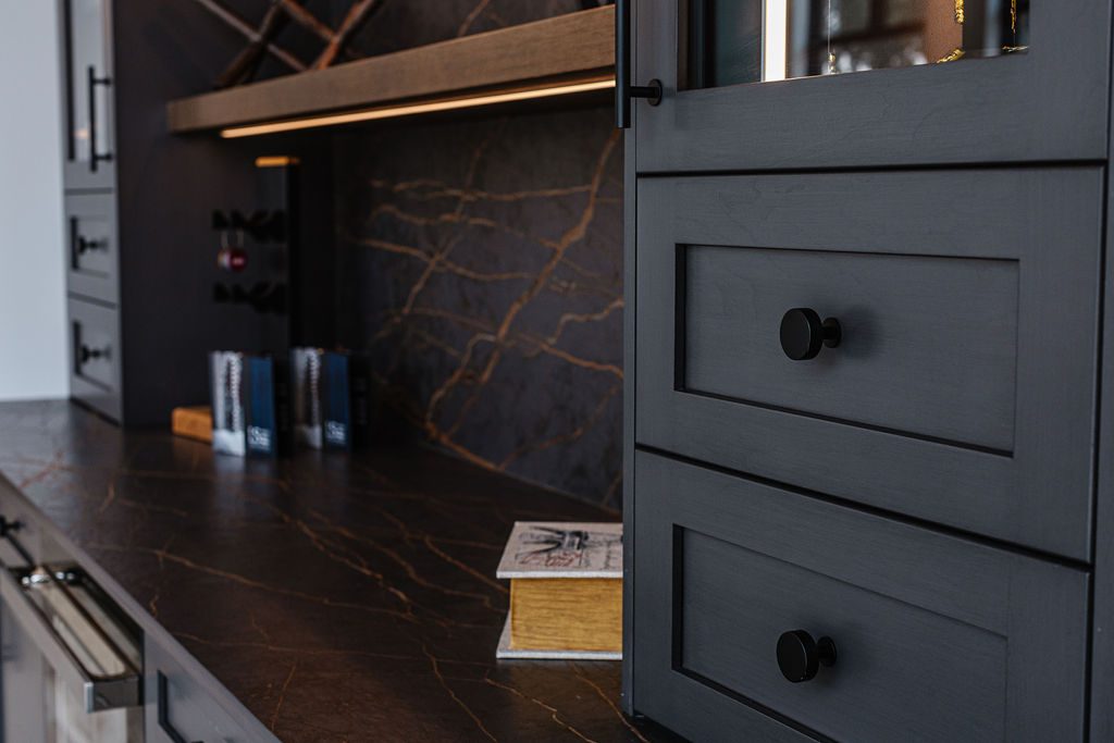 Dark millwork detail with stone