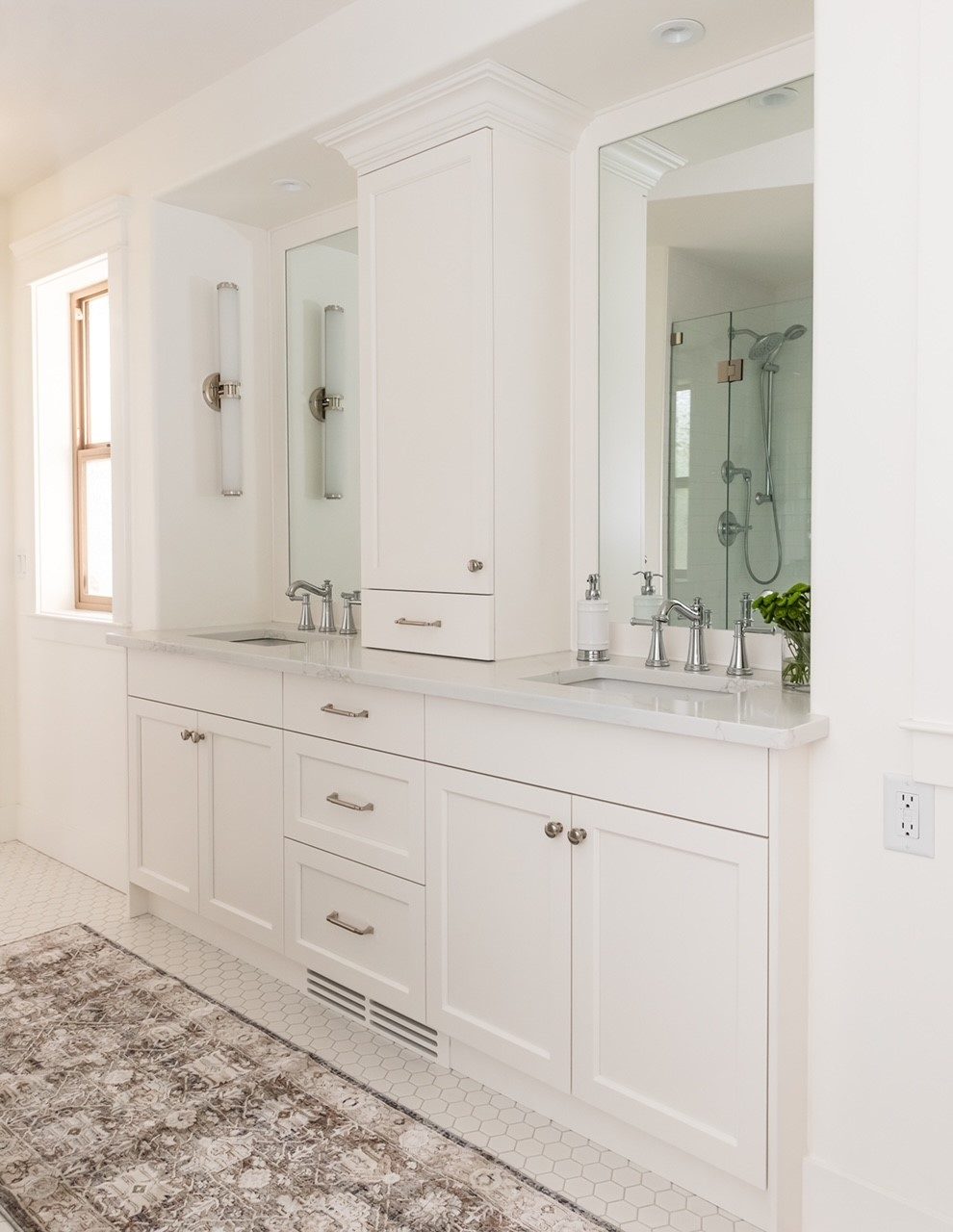 White double vanity millwork with linen tower